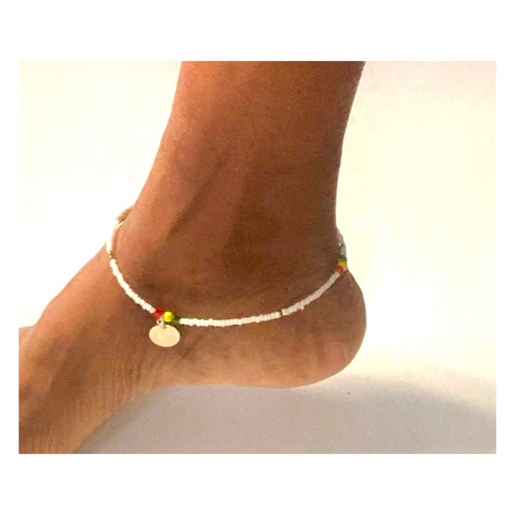 A pair of Beaded white anklets with dangles - Picture 2 of 3